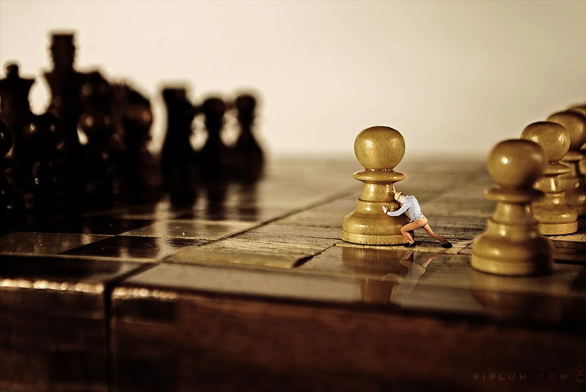 Big changes start with small steps man-playing-chess-surreal-photography