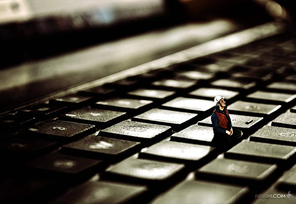 Sometimes you only need to press the right button. Surreal photograph man-sitting-on-a-keyboard-Surreal-photography