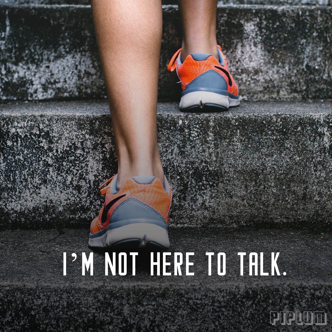 Workout Quote. Women steps on a stairs. Only sneakers visible.