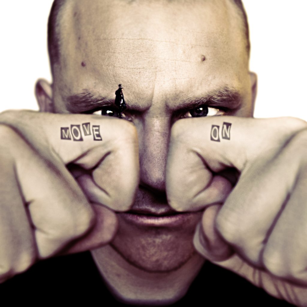 Man-face-with-bended-fingers-in-front-Text-tatoos-on-each-surreal-photography