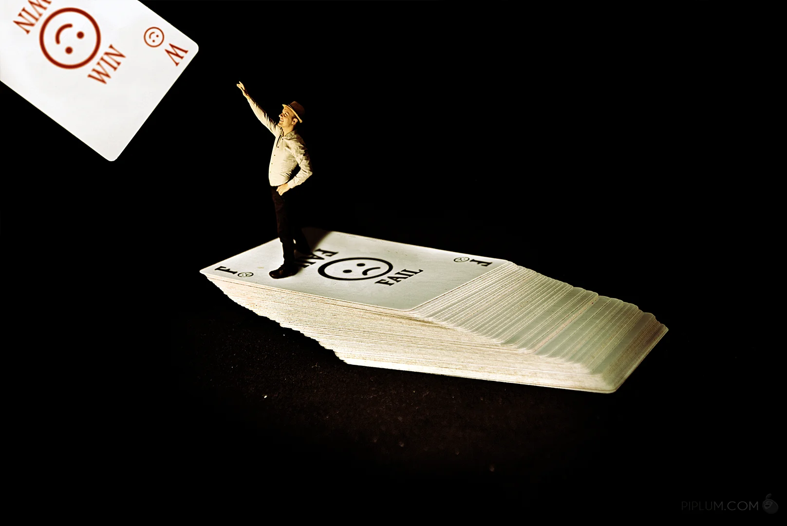 Maybe this card will be lucky? Motivational-Quote-Man-trying-to-pick-a-lucky-card-after-many-fails-surreal-miniature-photography-photo-manipulation
