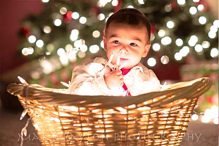 Kids playing with lights Christmas-kid-in-the-basket-gift