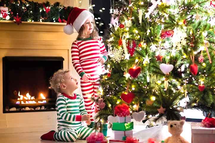 Kids playing with Christmas tree Kids-playing-with-christmas-tree