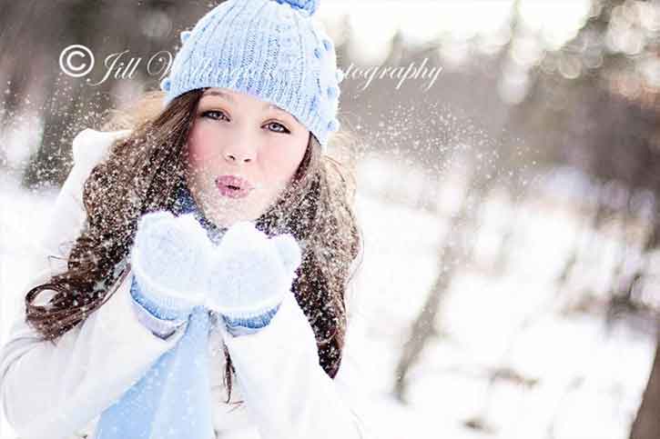 Portrait-photography-for-christmas-girl-blow-snowflakes