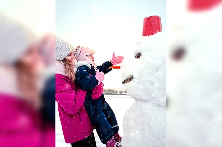 Touching a Snowman christmas-photo-with-snowman-touching-kid