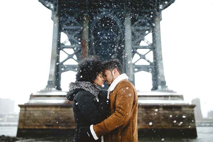 Pre-wedding photography couple-kissing-during-christmas-eve-winter-and-snow-everywhere-Pre-wedding-photography