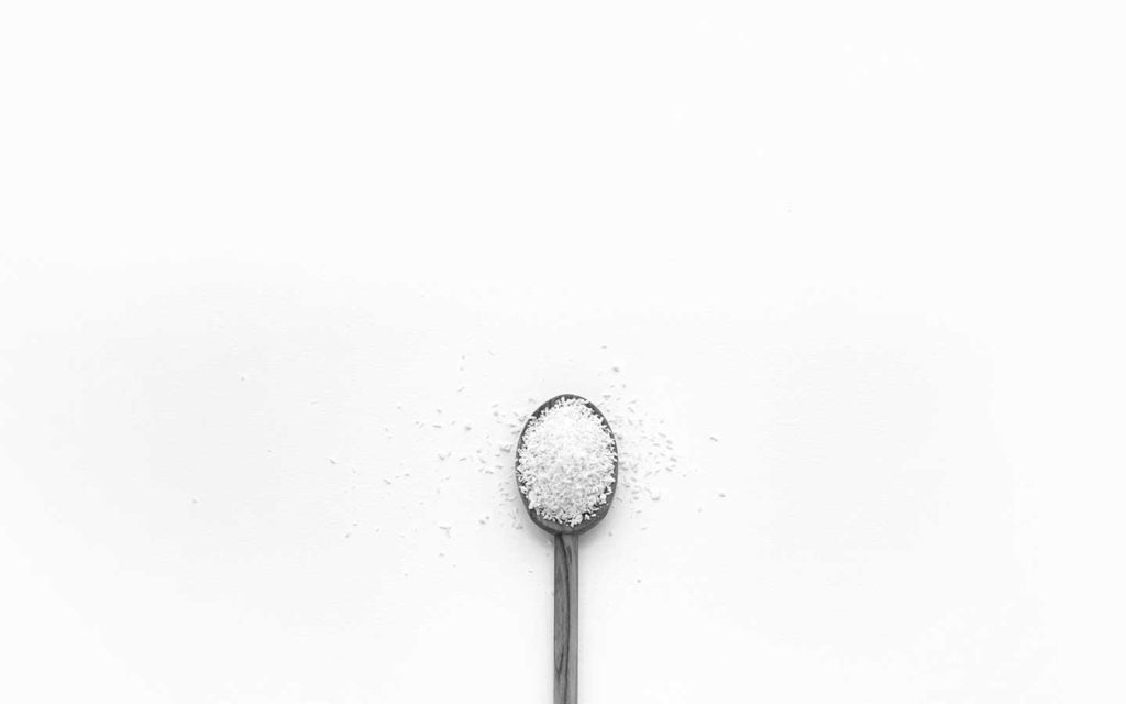 Healthy food without salt and sugar Healthy-food-without-salt-and-sugar-spoon-white-background