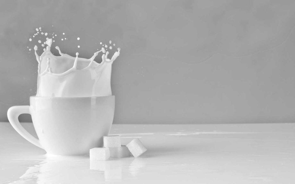Milk products are healthier without lactose Milk-products-are-healthier-without-lactose-cup-milk-splash-sugar