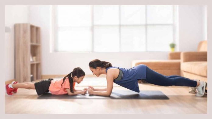 All family members can use this free workout program. Mom-and-child-doing-Free-Workout-Program-At-Home-With-No-Equipment-Required-for-family